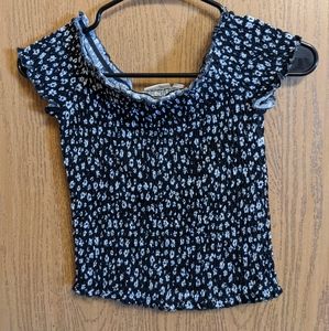 Black with white flower off the shoulder top